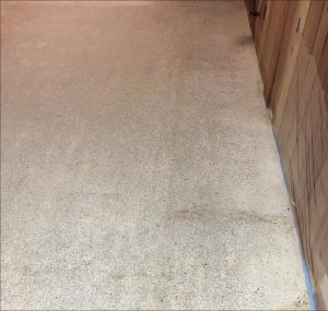 Acrylic removal from terrazzo by dry grinding. This also involves a thorough dust removal step while grinding.