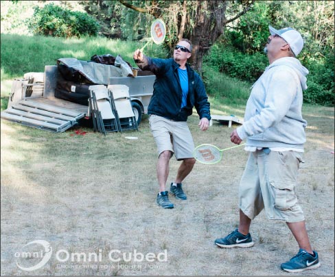 Team building: playing badminton at the company’s 15th Anniversary camp-out.