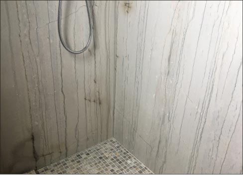 Seeing spots? You probably don’t need to have your eyes checked – just the adhesive used on your shower panels.