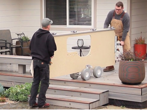 The Omni Cubed Pro-Dolly™ HD2 makes bringing tops onsite faster, safer and easier. Here, installers are using a Pro-Dolly™ and Sink Hole Saver Edge, and two Aqua-Jaw™ Carry Vises™ as handles.