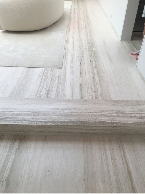 Vein cut Travertine slabs as flooring: what you see is what you get — including natural imperfections.