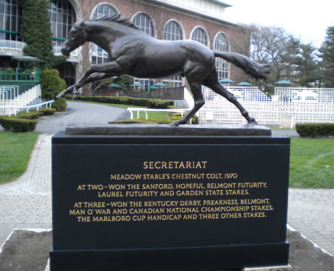 Black granite base for the Belmont, New York Racetrack. This sculpture and base are installed in the paddock in  honor of the thoroughbred Secretariat, 1973 Triple Crown winner. The base, fabricated by Proctor Marble Company, includes 541 hand carved V-grooved letters (double sided), finished with gold leaf. Base is 2-1/2 inch mitered Indian Black Granite. Bronze Secretariat Sculpture by John Skeaping.