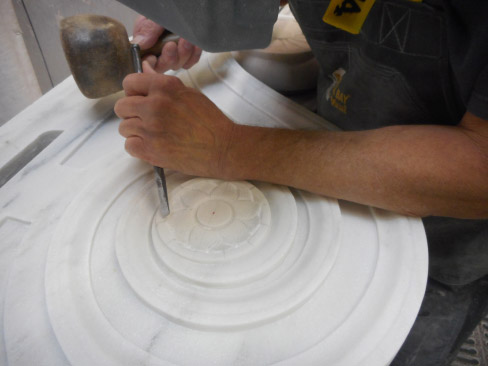 Brent Wilson hand finishing the flower detail on a Vermont Danby marble volute – one of 8 for the Hearst Neptune Pool restoration project.