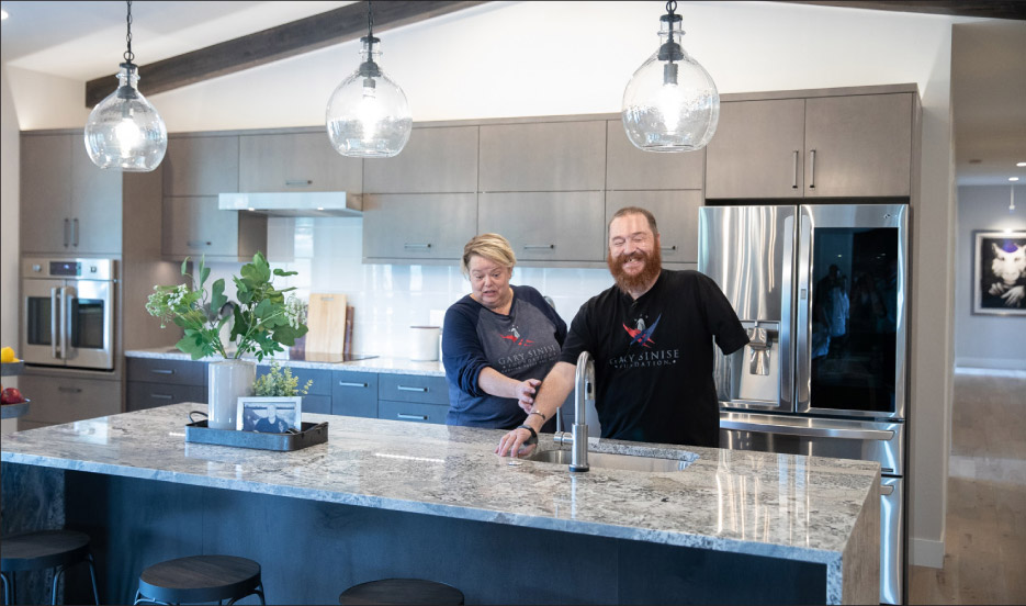 US Air Force TSgt Matthew Slaydon and his wife, Annette Slaydon in their new home.