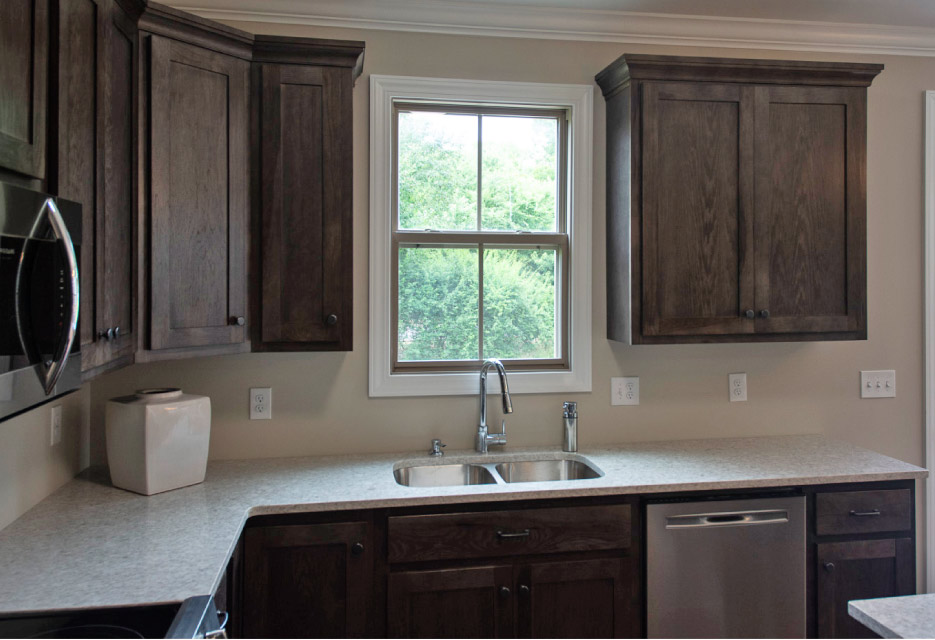 This 130 x 50 inch L-shaped Flaked Pearl LG quartz countertop is one the first that Stafford installed using his No-Lift cart, and Omni Cubed sink supports. “This top was fabricated in one piece, without any seams. I can’t imagine carrying this monster in without my install cart. With the sink cutout, it was delicate, going into a pretty narrow space between the outside wall and the island.”