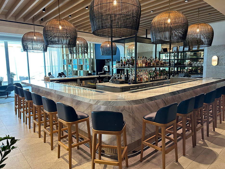 The Main Bar at OIA Restaurant – Goldwynn Resort & Residences. By Real Stone Bahama Ltd. division.