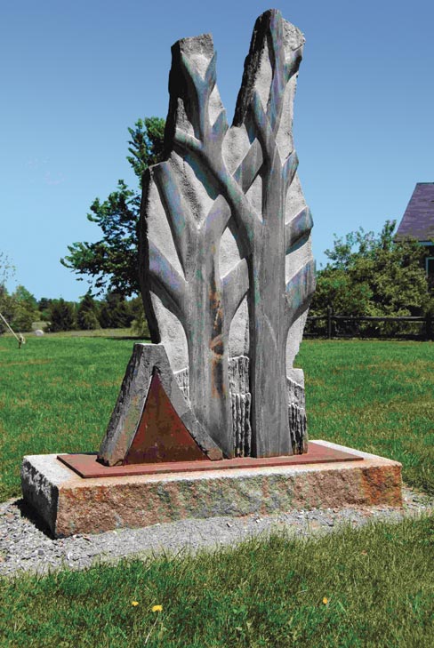 Bill Royall’s majestic “Autumn Hills” sculpture sits grandly within the lush green meadow of the Arboretum’s serene 224 acres.