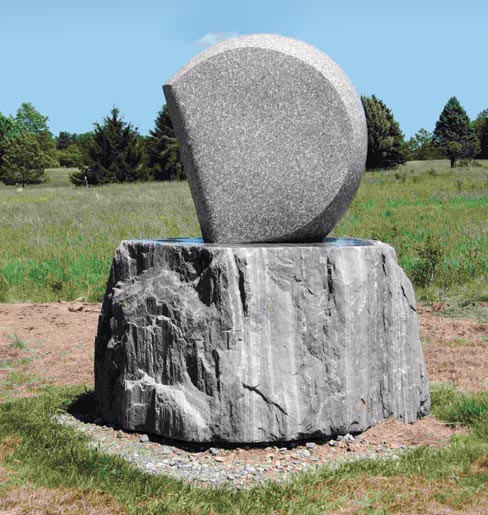 Still unnamed, this spherical sculpture by David Sywalski is carved from Chandler Bay granite, while the base was cut from Heritage Valley granite. Both were quarried in Jonesboro, Maine by J.C. Stone, Inc. Total height is about 5 feet and weighs in at about 3 tons.