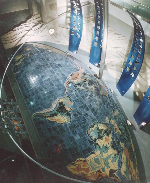 Project for the Denver International Airport, completed in 1994.  “Dual Meridian,” created by artist David Griggs, contains a world map mounted on a dome.