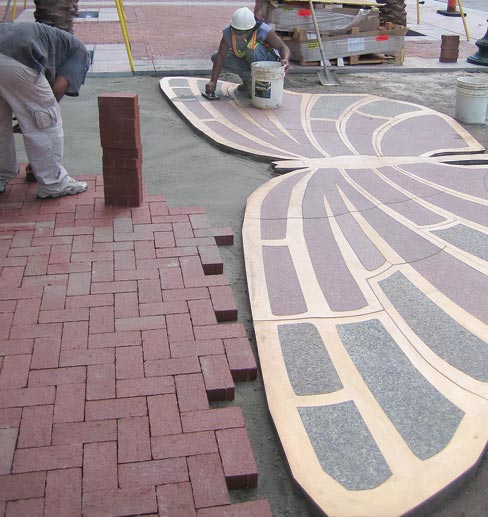 The Audubon Insectarium, in New Orleans, LA,  features a street-scape with a 2-inch thick granite and bronze butterfly. Brick pavers were then inset around the water-jet piece.