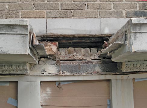 Balcony “H” in progress, with one floor tile removed. The tiles weighed in at 171 pounds apiece. Also visible here is  the exposed, weakened steel support.