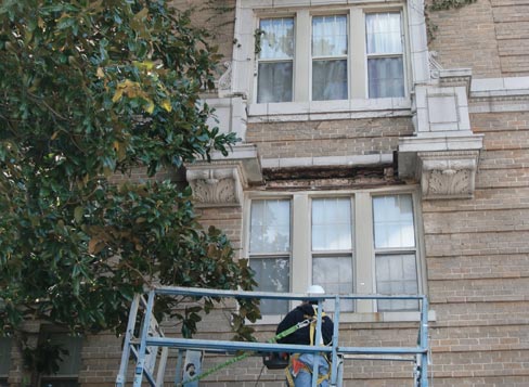  Hilgartner workers on the scaffolding sport mandatory safety gear, including hard hats and harnesses. Hilgartner training for restoration includes working on multi-story buildings.