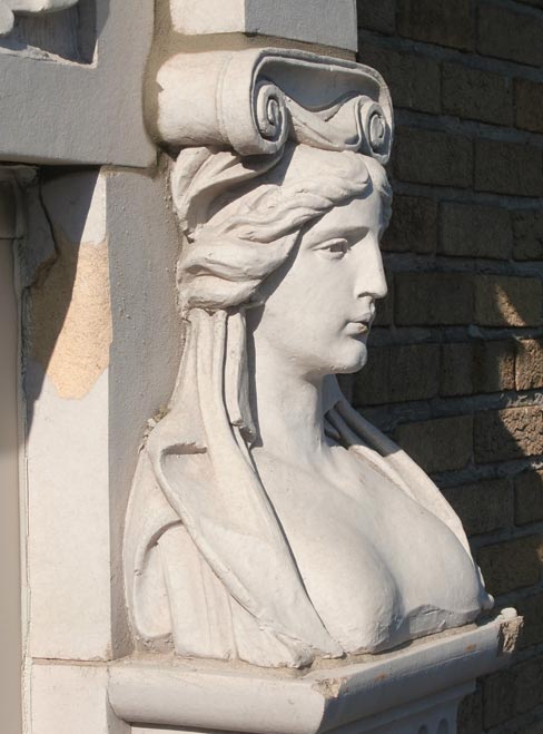 Full view of an upper floor balcony restoration, and a close-up of a terra cotta pilaster–preserving a jewel of architectural ornamentation.