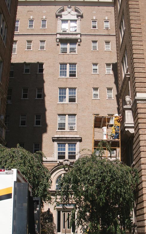 Full view of an upper floor balcony restoration, and a close-up of a terra cotta pilaster–preserving a jewel of architectural ornamentation.