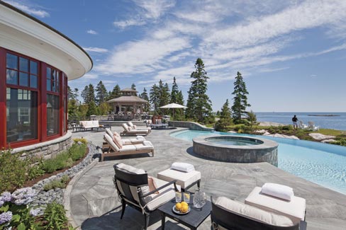 A patio of “Broken Ice” flagstones cut from Heritage Valley granite as well as capstones, veneer, steps, edging and sills graces this coastal setting. Sawn Heritage Valley stone is the rule and not the exception on this beautiful Maine home. 