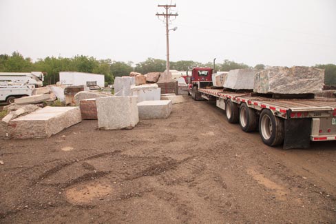 After two years of negotiations, this Spring  J.C. Stone Inc. started receiving  truckloads of dimensional granite from a Massachusetts company that had closed. At left on the flatbed is shown the first of 400+ loads. This material will then be sized to specification and used in the construction of a large biomedical research laboratory in Boston.