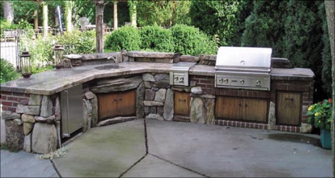 Jamieson Stoneworks occasionally builds outdoor kitchens, as well. This large example uses local quarried slabs for countertops, made from local three-inch granite and fully shaped, edged and polished (including the surface) with only hand tools.