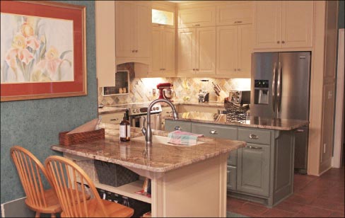 3cm Crema Bordeaux granite features a simple polished edge in this custom residential kitchen.