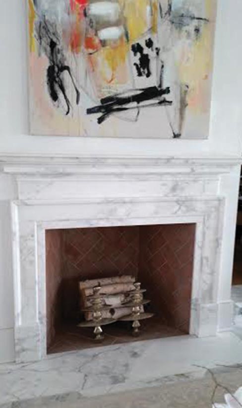 Calcutta Gold fireplace, custom- fabricated for a lavish residence on Sullivan’s Island, South Carolina.