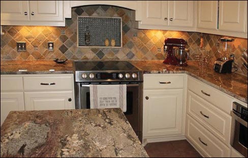 3cm Crema Bordeaux granite features a simple polished edge in this custom residential kitchen.