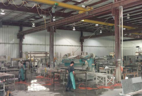 Employees Bradley Watson, Joshua Nelson and Mario Santiago hard at work, at their polishing stations. Real Value Inc. caters to custom homebuilders, homeowners and commercial jobs such as hotels and offices, which makes for a busy shop