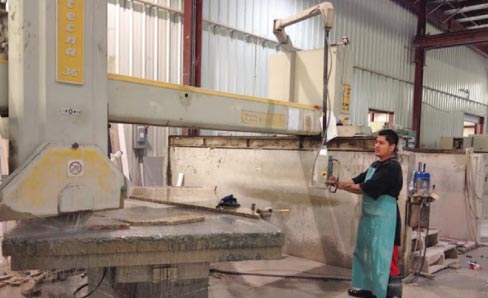 Saw operator Feliciano Guzman is shown putting a GMM Tecna 36 through its paces. “We have a clean, organized shop and everything is done using water. We also have cranes throughout the shop. So as far as stone handling goes, it’s a very good environment to work in,” said Syed Ahamed.