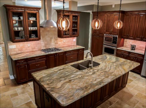 An extra large Fusion Quartzite island is the dramatic focal point in this custom remodel.  Quartzite of this quality is rare and, according to Gary Rogers, this very dense stone takes extra care to cut.