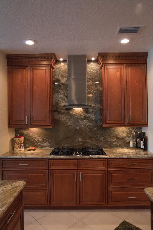 Above and Below: Full kitchen remodel featuring beveled 3cm Netuno Bordeaux granite countertops and full height backsplash makes the most of movement in the slabs. Akemi products were used to secure splashes as well as blend seams.