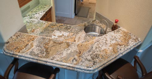 This kitchen featuring 3cm Persian Treasure from United Materials Inc. was fabricated with a double laminated ogee edge flowing into a demi bullnose. AGS Stone has continued from day-one to do edging free-handed using a right angle grinder or a router with profile wheels. “This was a passion project for the fabricators,” explained Alex Rogers, “And photos really do not do it justice.”