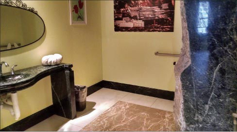 The Hilgartner headquarters in Baltimore has a custom, handicapped bathroom that also showcases their expert and tasteful handling of repurposed stone materials.