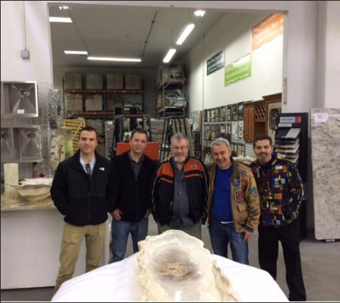 Fred Hueston and 2017 attendees visit a shop to study fabrication issues.