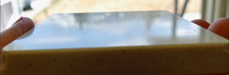 Damaged finish from kitchen sponge and Bar Keeper’s Friend (rough patch, left center) on this Cambria Templeton sample.