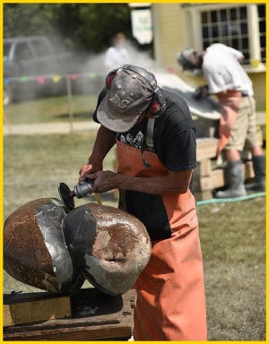 Herrington at work at the 2017 Boothbay Symposium. This biannual symposium brings together Maine artists and an international guest to work in Maine granite every other summer.