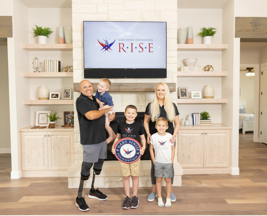 Juan Guerrero and family in their new Smart Home. Guerrero was critically injured while a U.S. Army Captain, and originally deployed in 1990 during the Gulf War. He served in over 350 combat missions during his military career, which was ended by an explosive EED in Iraq.