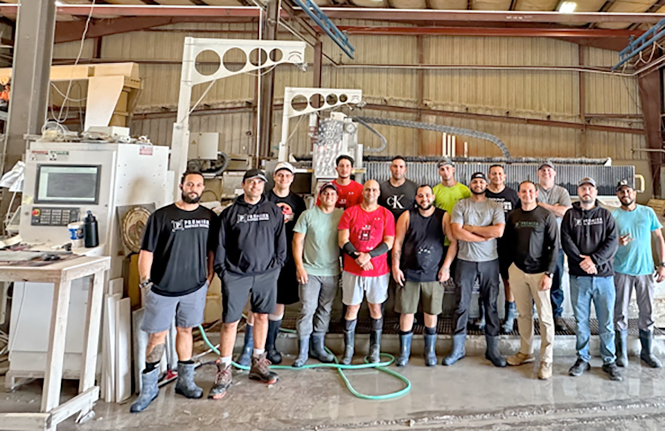 The Premier Surface Design fabrication crew run a fully-automated wet shop. The shop equipment includes a Northwood dual-table Raptor Sawjet, Northwood 138 CNC Router, Park Industries Saber CNC, Marmo Meccanica LCR edger, as well as their original Coch semi-manual bridge saw. Right: This spacious main bath features double vanities and custom walk-in / roll-in shower.