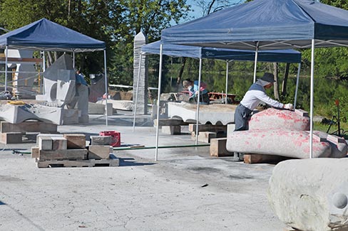 With great resolve and intent, sculptors Lee Zih-Cing, Taiwan; Shan-Chi Teng, Taiwan; and Koichi Ogino of Japan, labor to reveal the image that exists within the stone.