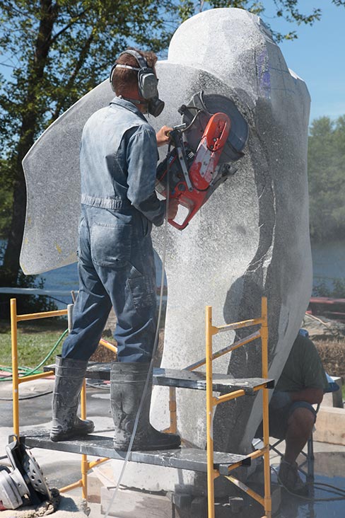  Sculptor Andreas Von Huene of Maine gently employs the raw power of a handheld two-stroke for heavy stock removal