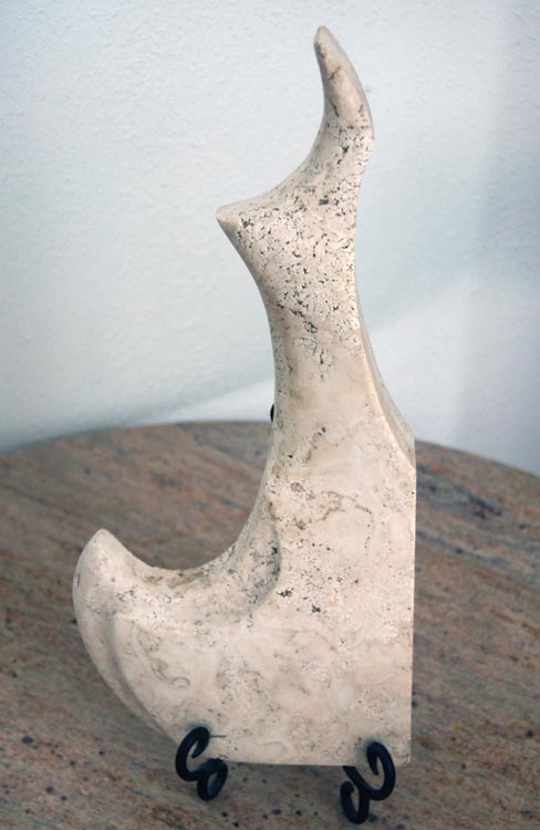 Freeform sculpture from Durango travertine. Hitman makes great use of re-purposing scrap pieces of exotic stone.