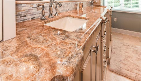 Above: This 3cm Ogee edge Honey Onyx vanity is just one of many exotic stone jobs Stone Creek has completed this year. The demand for quartzite and white marbles continues to increase among their upper-tier market customer. With such expensive material, it’s doubly important to take the most accurate layout measurements possible.