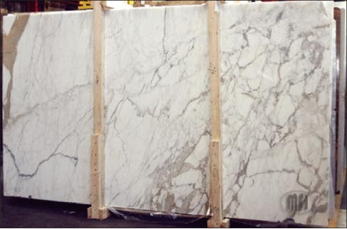 Calacatta Marble is distinctive with its thick, bold veining. Rather than the plentiful soft veins of a marble like Carrara, Calacatta’s hallmark is fewer but more dramatic and unstructured veins.