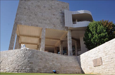 The Getty Center is clad with travertine. This photo shows one of the feature stones (far right), highlighted to show intriguing natural textures of the stone. Photo by ‘Ted,’ reused via Creative Commons license. Below: Fossilized leaves in a Getty Center feature stone