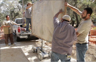 The Omni Cubed® Pro-Lift operates with a hand-held remote and is designed to be lightweight and super-strong.  It does the heavy lifting on the job site for you, and enables two or three installers to do the work of five or more people. It hoists up to a ton without batting an eye.    Photo courtesy Exodus Stone