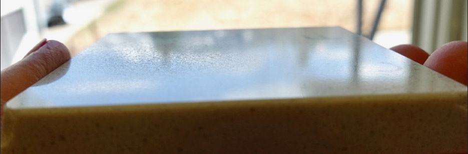 Damaged finish from kitchen sponge and Bar Keeper’s Friend (rough patch, left center) on this Cambria Templeton sample.