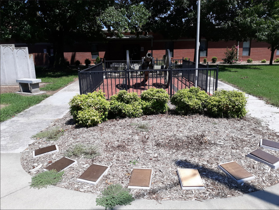 War Memorial at Walnut Grove High School, with engraved Phenix paving slats installe on both sides of a Civil War-era cannon, and Phenix benches and stone partitions.