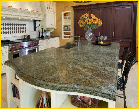 The leathered finish applied to this Verde Bellagio granite island brings out the rich color variations in this premium slab.