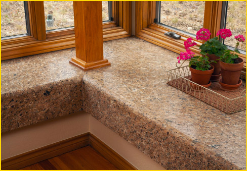 Sometimes a highly polished stone is just not the right choice. This leathered Brown Vincenza granite window seat and sill gives a softer, more natural effect than a polished slab would. 