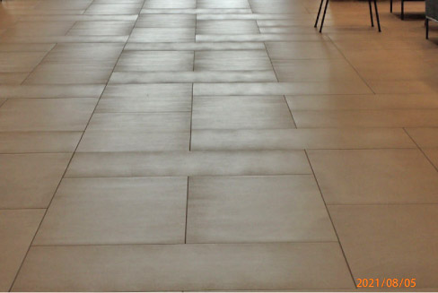 This is a properly laid floor of high-end, large format tiles, with no actual lippage. So what’s going on here?