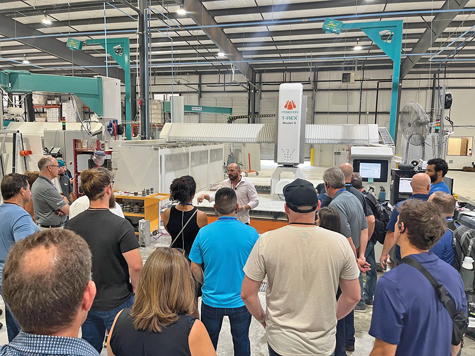 Rockheads members immersed in the wonders of innovation: Exploring the T-Rex machine by Poseidon Industries during an enriching visit to Star Lumber during the Oklahoma City Summer event. 