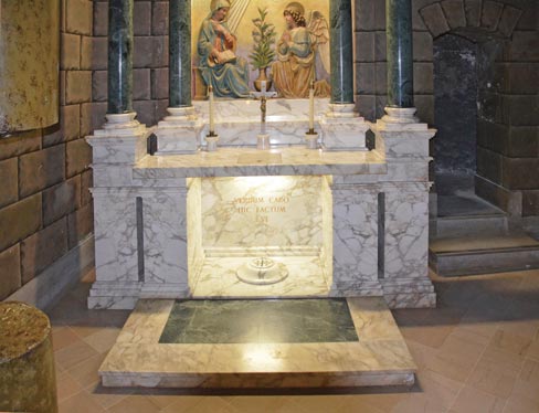 A closer view of the Nazareth Chapel white marble altar and step with a green marble inlay. 