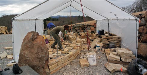 Construction started with the drystone walls. Mason Gary Wilson works beneath the winter shelter. Masons Fred Lashley and Jonathan Frederick (not pictured) round out the Hammerhead crew and contributed their talents to completing the Scared Circle.